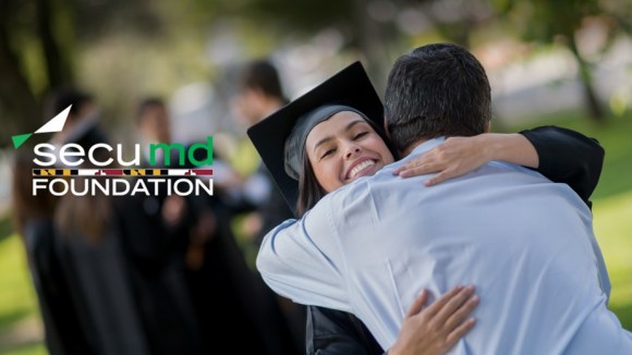 Scholar gives a hug on graduation day.